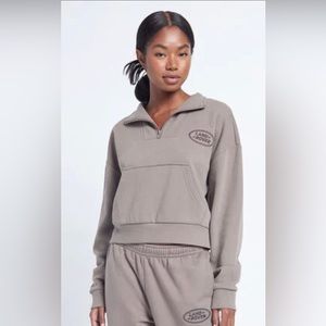 Light brown Land Rover cropped quarter zip